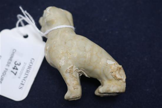 An early 18th century Chinese porcelain figure of a dog